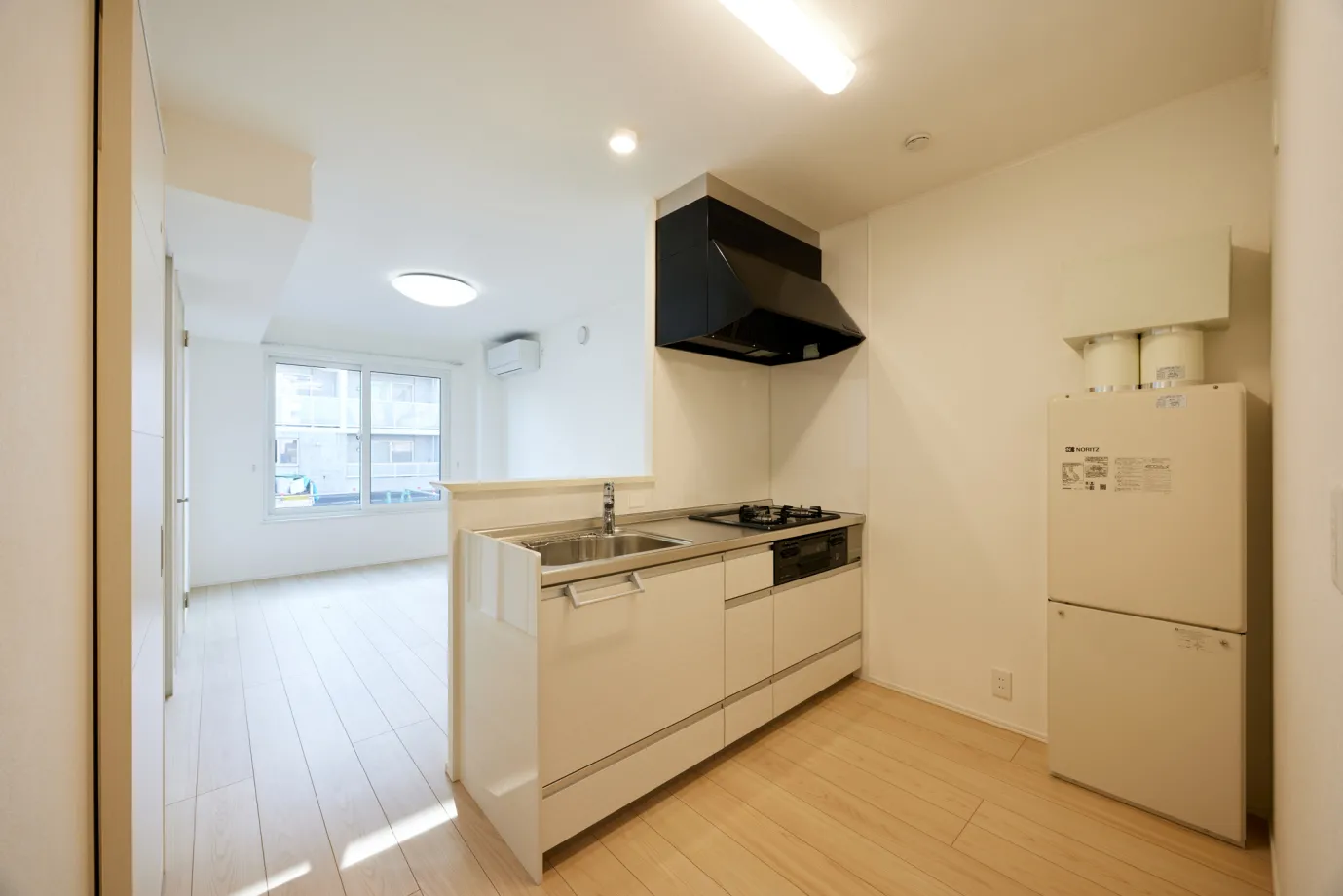 キッチンはリビング・ダイニングとシームレスにつながる対面タイプ